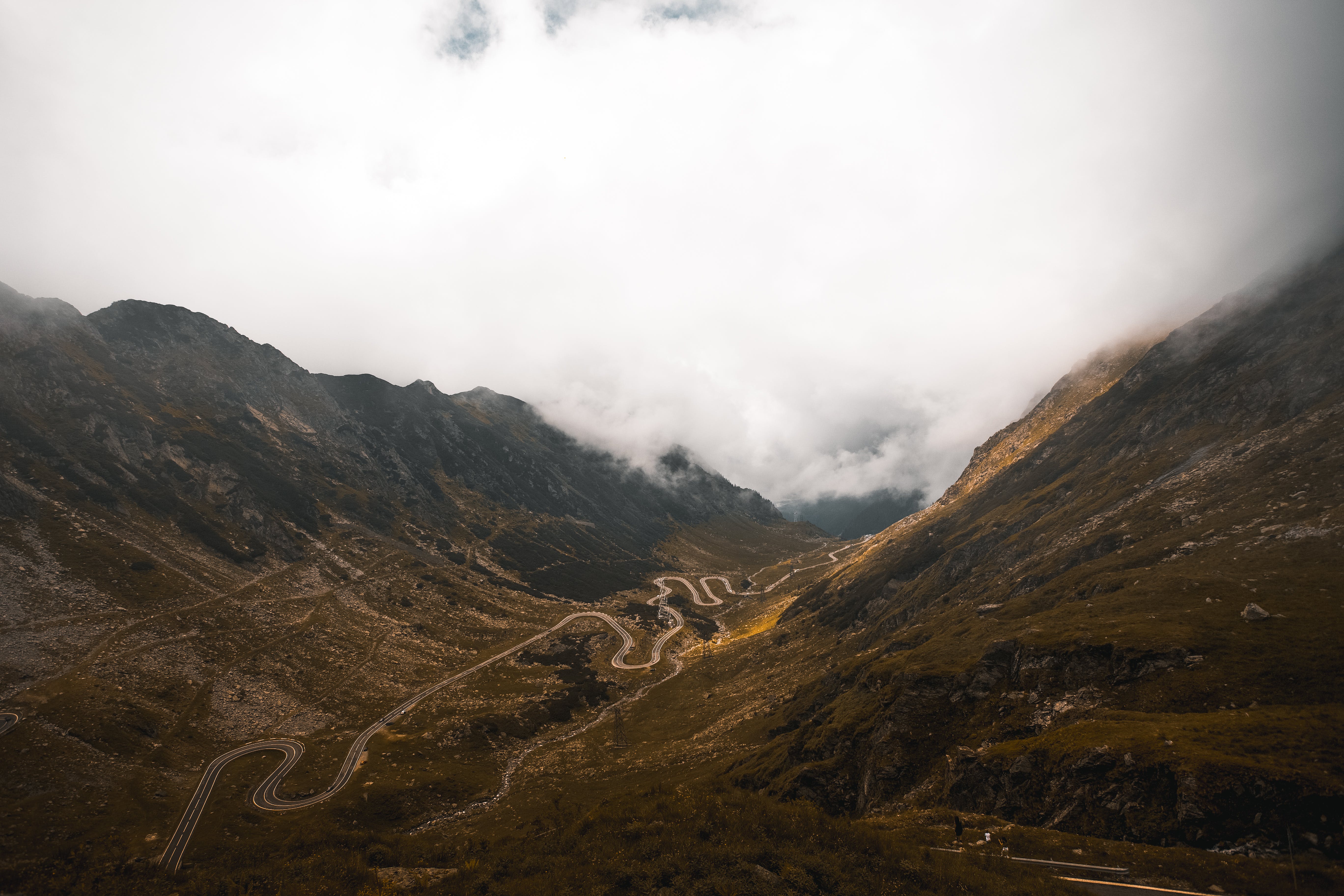 Brown and Green Mountains Under White Clouds